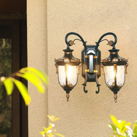 Countryside Black/Gold-Copper Urn Wall Sconce Light With Clear Glass - 2 Bulbs Black-Gold
