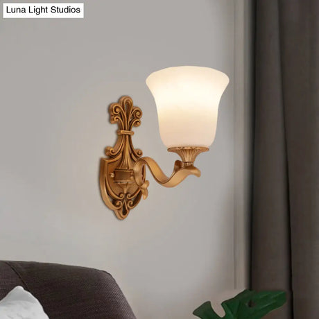 Countryside Opal Glass Wall Sconce With Brass Finish And Curvy Arm