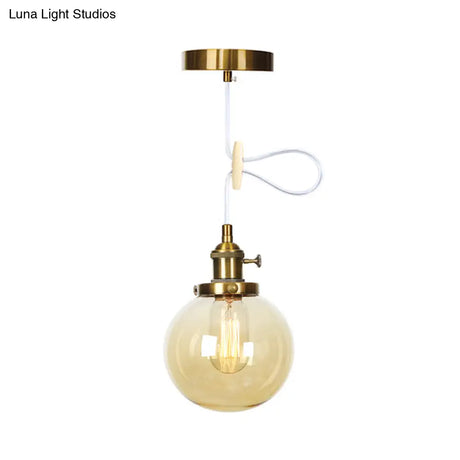 Farmhouse Orbit Pendant Light With Amber/Clear Glass And Adjustable Cord In 3 Elegant Finish Options