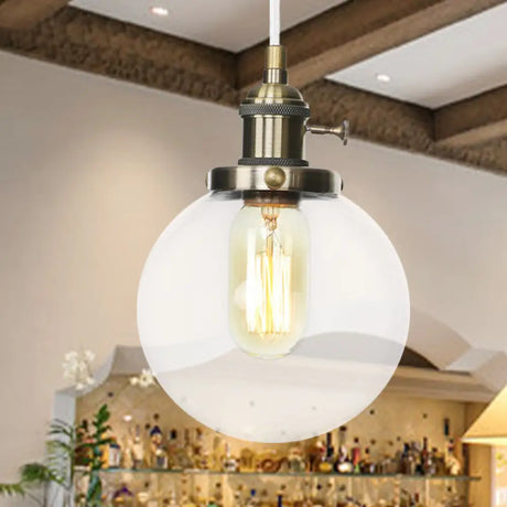 Farmhouse Orbit Pendant Light With Amber/Clear Glass And Adjustable Cord In 3 Elegant Finish