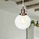 Farmhouse Orbit Pendant Light With Amber/Clear Glass And Adjustable Cord In 3 Elegant Finish