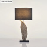 Feather Base Nightstand Lamp In Black With Classic Drum Shade For A Cozy Bedside Ambiance