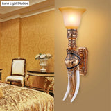 Flared Amber Glass Wall Mount Light With Gold Elephant Base - Traditional 1-Light Sconce