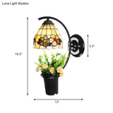 Flower-Trimmed Tiffany Wall Sconce With Beige Glass Dome And Black Mount