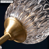 Gold Finish Chandelier With Metallic Branch Design And Clear Crystal Shade