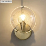 Gold Metal Wall Sconce With Clear Glass Shade - Postmodern 1-Light Fixture