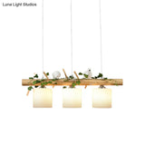 Industrial 3-Light Hanging Pendant For Coffee Shop With Milky Glass Cylinder Wooden Stick And Bird