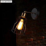 Industrial Black Metal Wall Lamp With Swivel Arm And Cage Shade