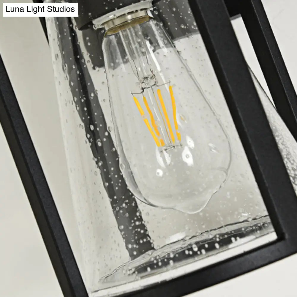 Industrial Black Sconce With Seeded Glass And Metal Cage