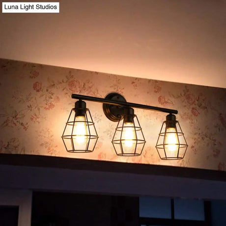 Industrial Linear Iron Wall Mounted Vanity Light With Clear Glass And Diamond Cage In Black - 3-Head