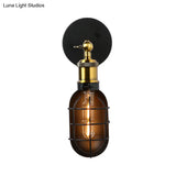 Industrial Metal Black And Brass Wall Lamp With Capsule Cage Design - 1 Head Sconce For Restaurant
