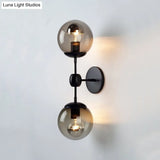 Industrial-Style Black 2-Light Sconce With Amber Glass Globes - Perfect For Living Room Lighting