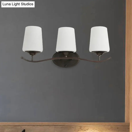 Ivory Glass Vanity Lighting With Iron Wavy Arm - Traditional Black Tapered Wall Light For Bedroom