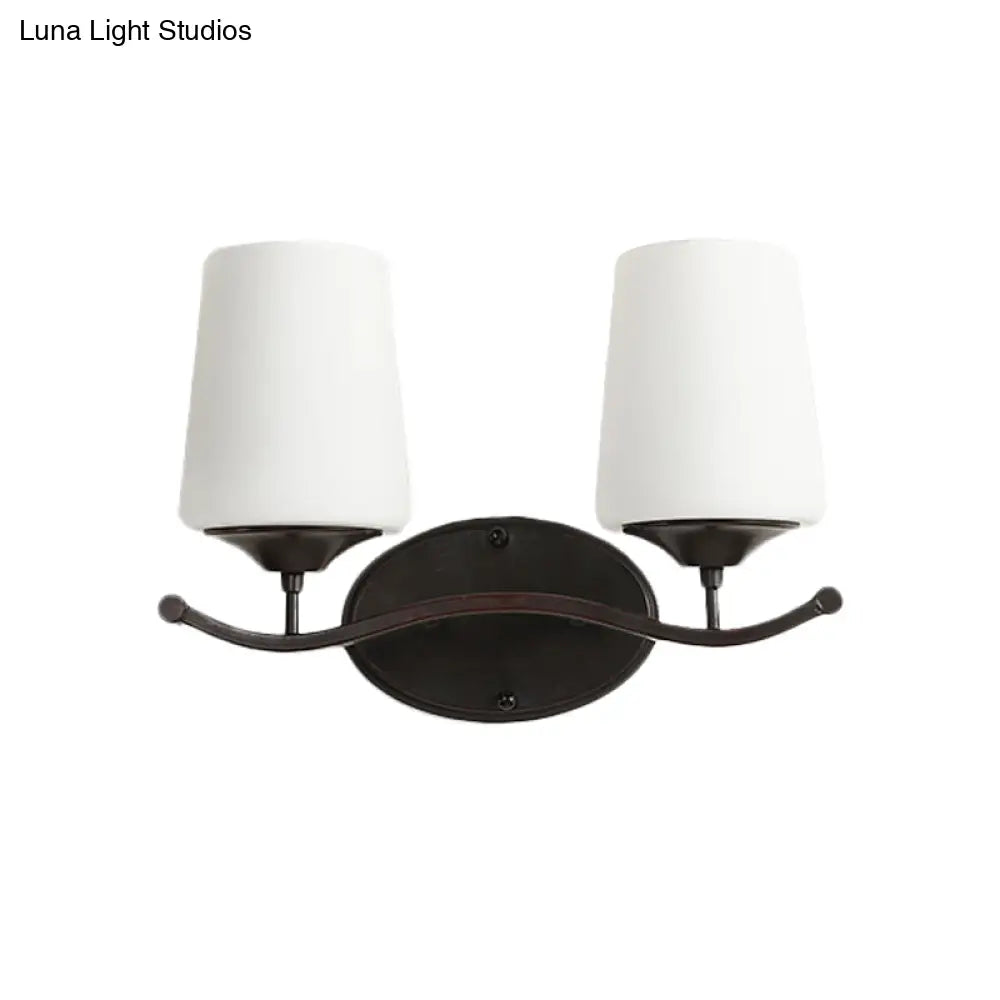 Ivory Glass Vanity Lighting With Iron Wavy Arm - Traditional Black Tapered Wall Light For Bedroom