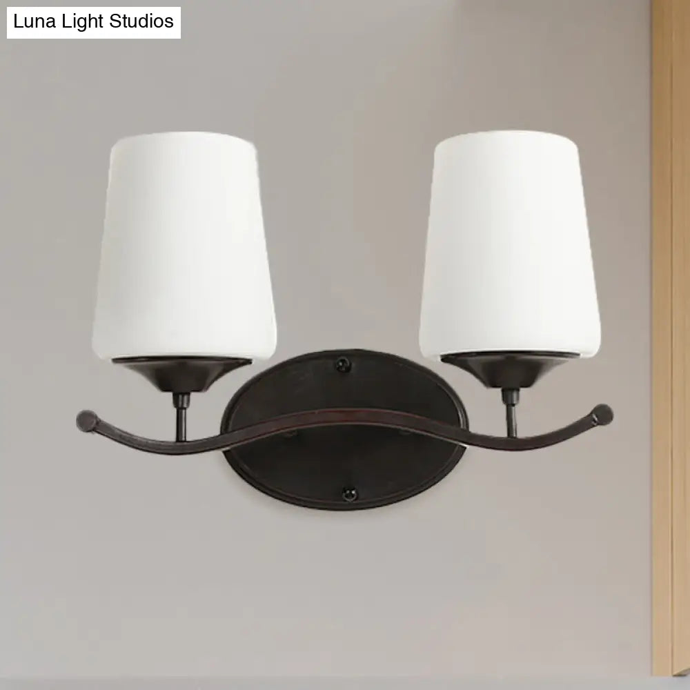 Ivory Glass Vanity Lighting With Iron Wavy Arm - Traditional Black Tapered Wall Light For Bedroom