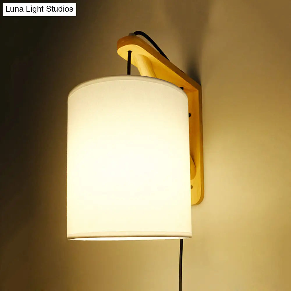 Japanese Style Cylindrical Fabric Wall Sconce With 1-Bulb And Wood Mount