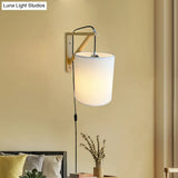 Japanese Style Cylindrical Fabric Wall Sconce With 1-Bulb And Wood Mount