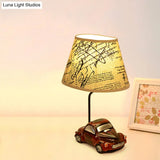 Kids Beige Barrel Night Table Lamp With Car Base - 1-Light Fabric Bedroom Nightstand Light