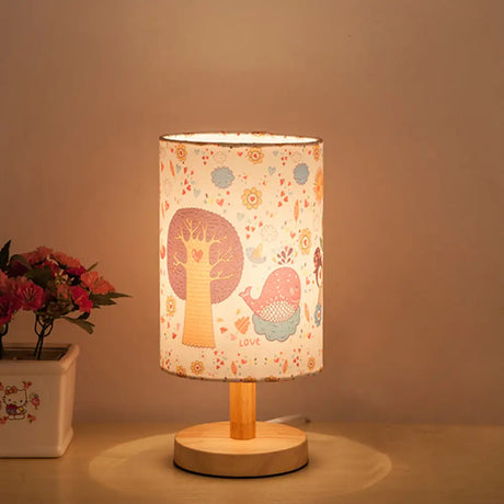 Kids Wood Cylinder Nightstand Lamp With Tree And Flower Pattern - Fabric Shade