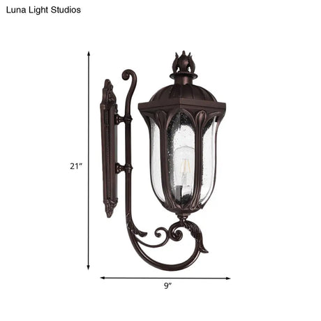 Lodge 1-Head Courtyard Wall Light Fixture With Seedy Glass And Swooping Arm In Dark Coffee