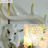 Loft Style Wall Mounted Sconce With Clear Crystal Shade Blue/Gold Finish And Deer Head Accent