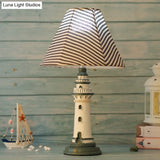 Mediterranean Tapered Night Light Fabric Table Lamp With Nautical Design And Lighthouse Base