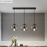 Minimalist Black Glass Pendant Light For Modern Dining Rooms