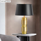 Minimalist Black Metal Table Light With Barrel Fabric Shade For Bedroom Night Lighting