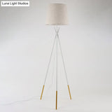 Minimalist Black/White Tapered Floor Lamp With Brass Accents