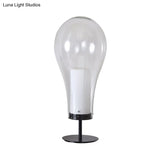Minimalist Clear Glass Table Lamp - Compact Bulb-Shape Desk Light For Bedroom