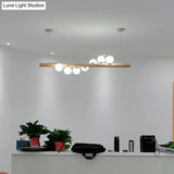 Minimalist Cream Glass Led Pendant Light For Restaurants - Ball Island Ceiling With Wood Accent