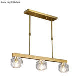 Minimalist Gold Island Pendant Light With Faceted Crystal Sphere And Linear Design - 3/4 Lights