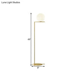 Minimalist Gold Orb Floor Lamp With Frosted Glass Shade And Right Angle Stand
