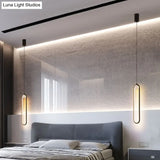 Minimalist Led Oval Metallic Pendulum Pendant Ceiling Light In Black With Natural Lighting