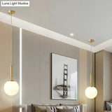 Minimalist Milk Glass Ball Pendant Light In Brass - 1-Light Hanging Lamp For Dining Room