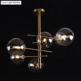 Minimalist Smoke Gray Glass Semi Flush Mount Light With Brass Accents - 6/9 Globe Shaped Fixture