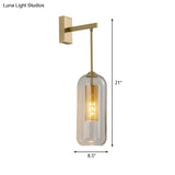 Modern 1-Head Gold Wall Mount Light For Bedside - Clear Glass Capsule Sconce Fixture