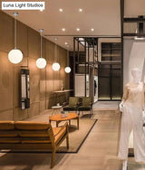 Modern 1 Light Glass Ball Pendant For Clothing Store Ceiling Simple & White