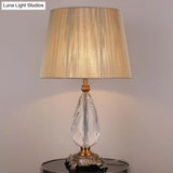 Modern Beige Table Lamp With Flared Wide Base And Fabric Shade