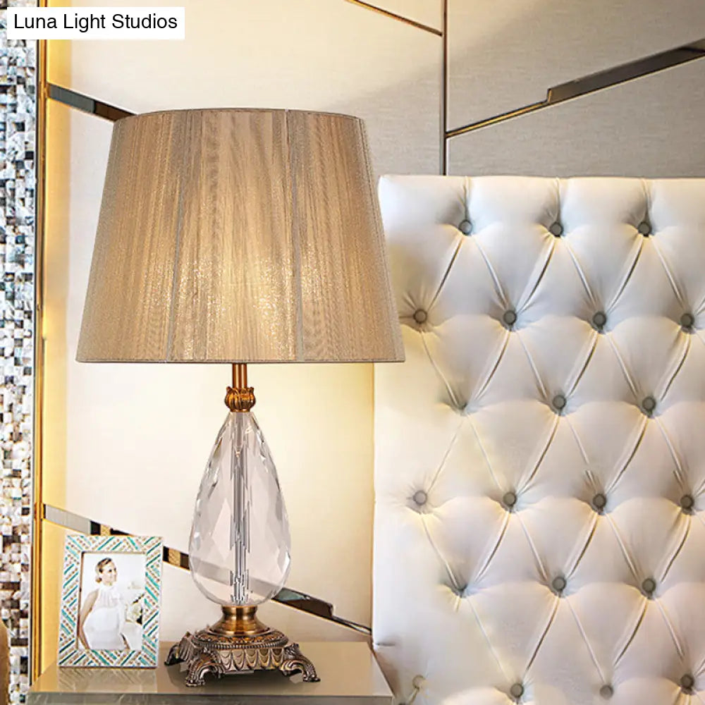 Modern Beige Table Lamp With Flared Wide Base And Fabric Shade