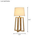 Modern Beige Trapezoid Nightstand Lamp With Wood Base And Tapered Fabric Shade