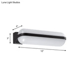 Modern Black Acrylic Wall Sconce With Flush Capsule Design And Half-Bulb Mounting
