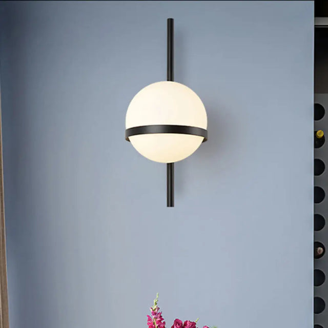 Modern Black/Gold Vertical Wall Sconce With Orbit Opal Glass Shade - 1 Head Metal Lamp 6/8 Width