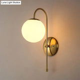 Modern Brass Globe Wall Sconce With Opal Glass Shade For Coffee Shop (1 Light)