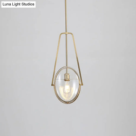 Modern Brass Pendant Light With Clear Glass Shade And Unique Halberd Frame