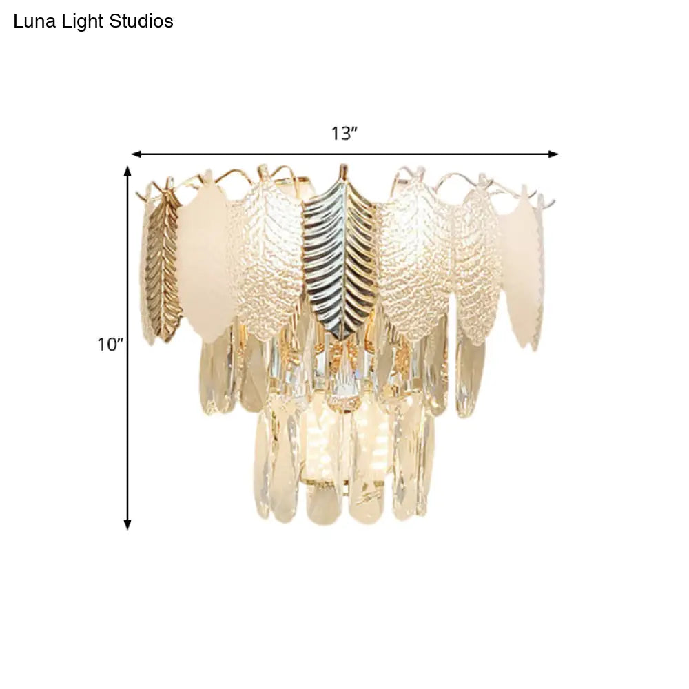 Modern Crystal Wall Sconce With Tapered Design Golden Accents And Acrylic Leaves