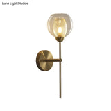 Modern Dual Cup Wall Sconce With Clear Glass And Metallic Finish In Black/Gold