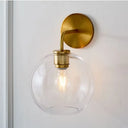 Modern Glass Orb Wall Sconce With Brass Arm Clear/White Clear