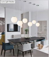 Modern Glass Pendant Lighting Fixture - White Hanging Light For Globe Clothes Shop