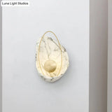 Modern Metal Led Wall Lamp: Resin Shell Shape Single Head White/Black Light